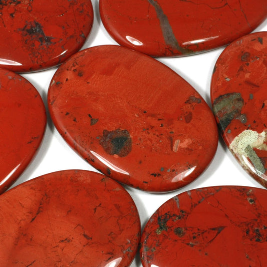 flat inch long ovular stones in reddish brown with brown and cream inclusions