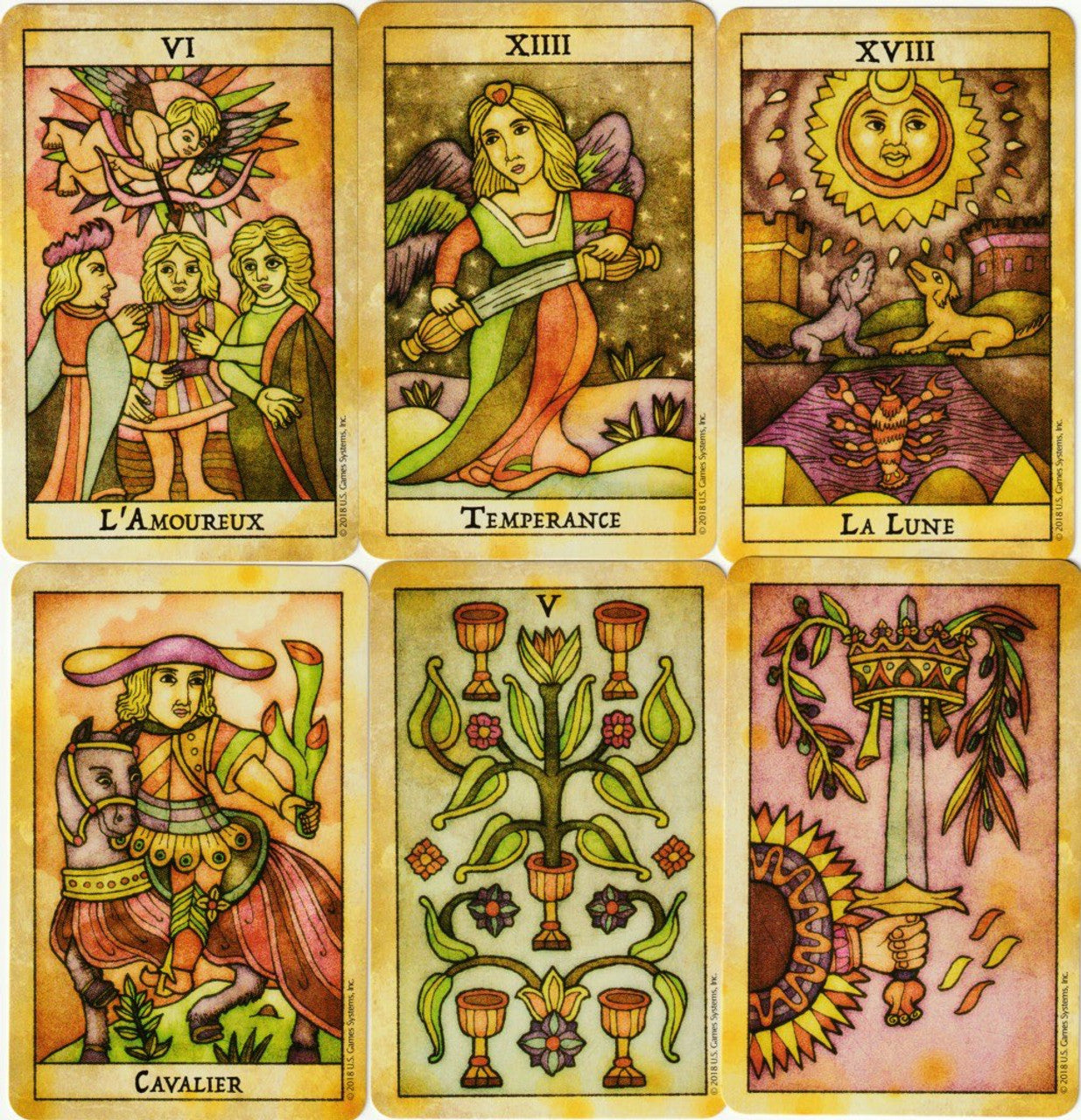 Set of six tarot cards with various symbols and text