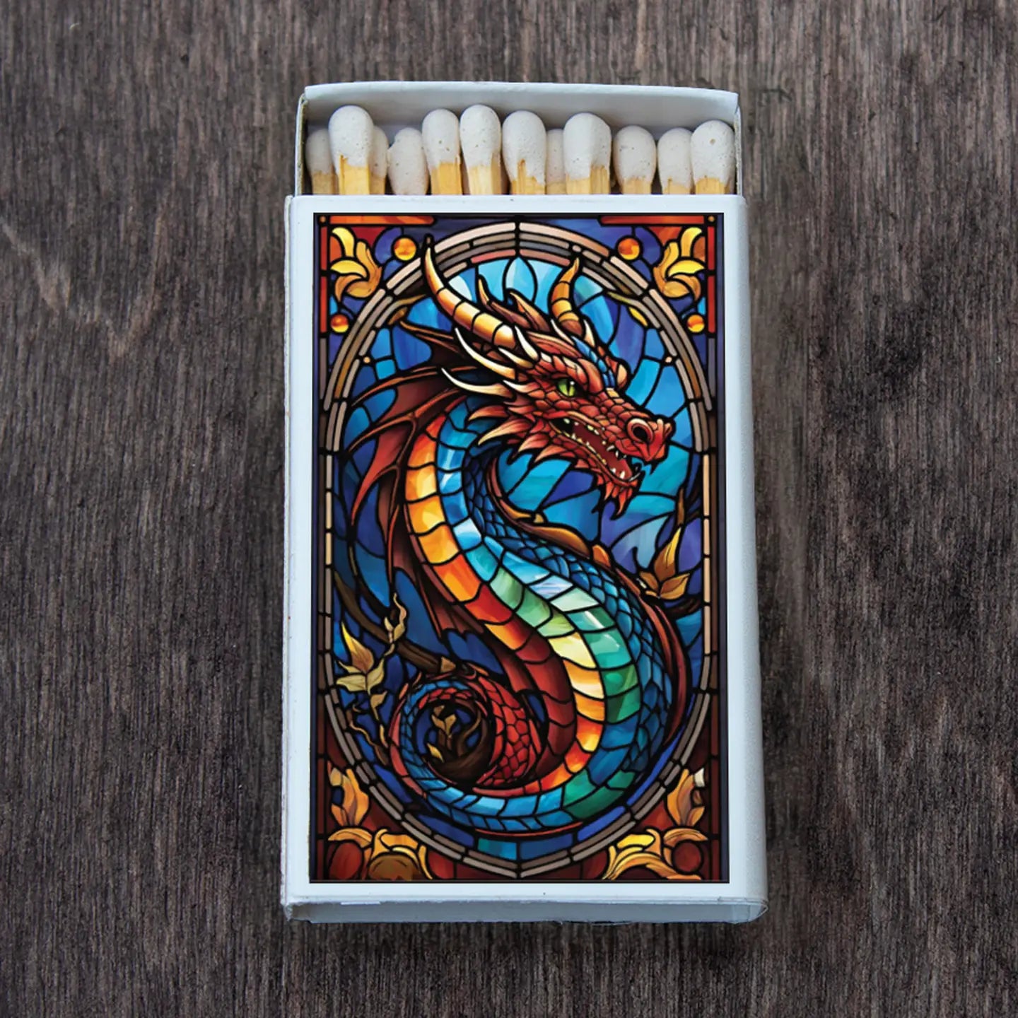 image of open matchbox, stained glass dragon