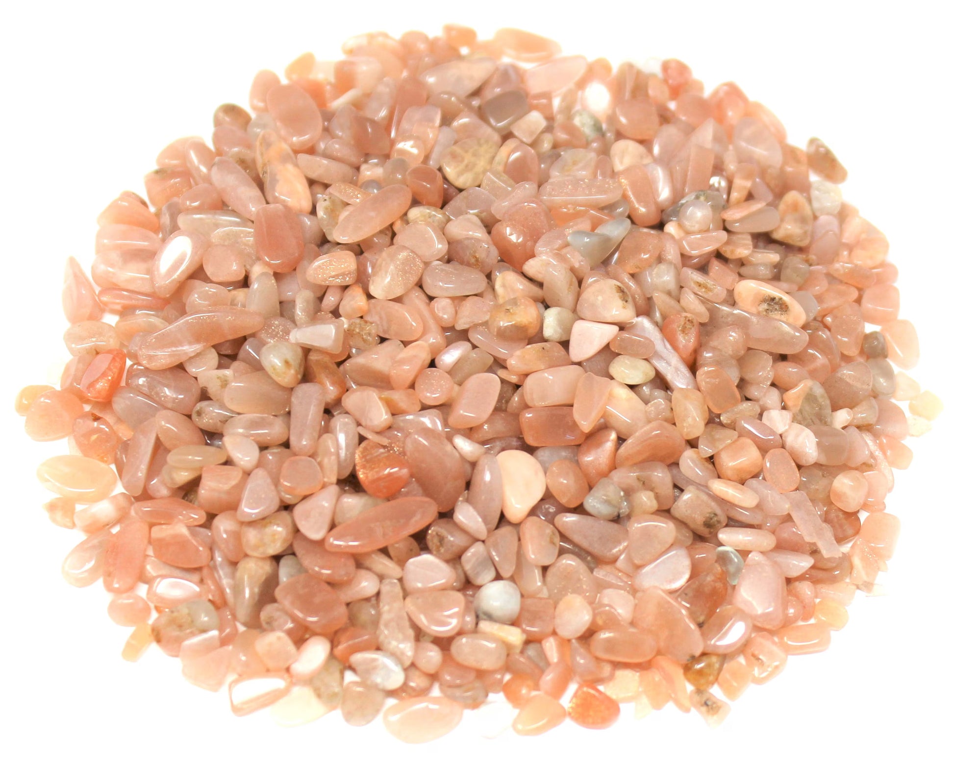 Pile of small stones with a pinkish-orange hue on a white background